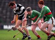 28 February 1998; Robert Fitzgerald of Clarecastle in action against Joe Errity, left, and Barry Whelahan of Birr during the AIB All-Ireland Club Hurling Championship Semi-Final Replay match between Birr and Clarecastle at Semple Stadium in Thurles, Tipperary. Photo by Ray McManus/Sportsfile