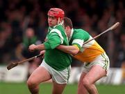 8 March 1998; T.J Ryan of Limerick is tackled by Kevin Martin of Offaly during the Church & General National Hurling League Division 1A match between Offaly and Limerick at St Brendan's Park in Birr, Offaly. Photo by Matt Browne/Sportsfile