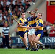 6 July 1997; Tommy Dunne of Tipperay in action against Ollie Baker, left, and Liam Doyle of Clare, right, during the Munster Final between Clare and Tipperary at Páirc Uí Chaoimh, Cork. Photo by Ray McManus/Sportsfile