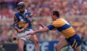 14 September 1997; Tommy Dunne of Tipperary in action against Ollie Baker of Clare during the Guinness All Ireland Hurling Final match between Clare and Tipperary at Croke Park in Dublin. Photo by Ray McManus/Sportsfile