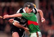 15 February 1998; Victor O'Loughlin of Clarecastle in action against Niall Claffey of Birr during the AIB All-Ireland Club Hurling Championship Semi-Final match between Birr and Clarecastle at Semple Stadium in Thurles Tipperary. Photo by Ray McManus/Sportsfile