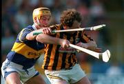 31 May 1997; Willie O' Connor of Kilkenny in action against Liam Cahill of Tipperary during the Church & General National Hurling League match between Kilkenny and Tipperary at the Stemple Stadium in Tipperary. Photo by Ray McManus/Sportsfile