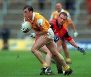 28 May 2000; Peter McConn of Antrim in action against Ciaran Byrne of Down during the Bank of Ireland Ulster Senior Football Championship Quarter-Final between Antrim and Down at Casement Park in Belfast, Antrim. Photo by David Maher/Sportsfile