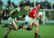 20 May 2000; Philip Clifford of Cork in action against Stephen Lucey of Limerick during the Bank of Ireland Munster Senior Football Championship Quarter-Final match between Limerick and Cork at Fitzgerald Park in Kilmallock, Limerick. Photo by Damien Eagers/Sportsfile