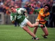 2 July 2000; Shane King of Fermanagh in action against Jim McGuinness of Donegal during the Bank of Ireland Ulster Senior Football Championship Quarter-Final match between Donegal and Fermanagh at MacCumhaill Park in Ballybofey, Donegal. Photo by Ray Lohan/Sportsfile