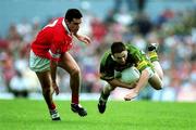 18 June 2000; Enda Galvin of Kerry is tackled by Martin Cronin of Cork during the Bank of Ireland Munster Senior Football Championship Semi-Final match between Kerry and Cork at Fitzgerald Stadium in Killarney, Kerry. Photo by Brendan Moran/Sportsfile