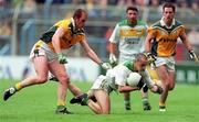 4 June 2000; Barry Malone of Offaly is tackled by John McDermott, left, and Ronan Fitzsimons of Meath during the Bank of Ireland Leinster Senior Football Championship Quarter-Final match between Offaly and Meath in Croke Park, Dublin. Photo by Damien Eagers/Sportsfile