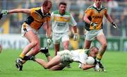 4 June 2000; Barry Malone of Offaly is tackled by John McDermott, left and Ronan Fitzsimons of Meath during the Bank of Ireland Leinster Senior Football Championship Quarter-Final match between Offaly and Meath in Croke Park, Dublin. Photo by Damien Eagers/Sportsfile