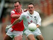11 June 2000; Brian Lacey of Kildare in action against Cathal O'Hanlon of Louth during the Bank of Ireland Leinster Senior Football Championship Quarter-Final match between Kildare and Louth at Croke Park in Dublin. Photo by Brendan Moran/Sportsfile