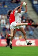 11 June 2000; Dermot Earley of Kildare fields a high ball ahead of Simon Gerard of Louth during the Bank of Ireland Leinster Senior Football Championship Quarter-Final match between Kildare and Louth at Croke Park in Dublin. Photo by Brendan Moran/Sportsfile