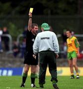 2 July 2000; Referee Des Joyce shows a yellow card to Donegal manager Declan Bonner during the Bank of Ireland Ulster Senior Football Championship Quarter-Final match between Donegal and Fermanagh at MacCumhaill Park in Ballybofey, Donegal. Photo by Ray Lohan/Sportsfile
