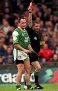 11 June 2000; Tony Collins of Fermanagh is shown a red card by referee Des Joyce during the Bank of Ireland Ulster Senior Football Championship Quarter-Final match between Donegal and Fermanagh at MacCumhaill Park in Ballybofey, Donegal. Photo by Ray Lohan/Sportsfile