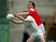 11 June 2000; Tadhg Fennin of Kildare in action against Brien Phillips of Louth during the Bank of Ireland Leinster Senior Football Championship Quarter-Final match between Kildare and Louth at Croke Park in Dublin. Photo by Brendan Moran/Sportsfile