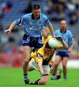 11 June 2000; Tom Howlin of Wexford in action against Darren Homan of Dublin during the Bank of Ireland Leinster Senior Football Championship Quarter-Final match between Dublin and Wexford at Croke Park in Dublin. Photo by Brendan Moran/Sportsfile