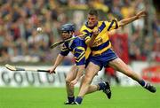 11 June 2000; Alan Markham of Clare in action against Paddy O'Brien of Tipperary during the Guinness Munster Senior Hurling Championship Semi-Final match between Tipperary and Clare at Páirc Ui Chaoimh in Cork. Photo by Ray McManus/Sportsfile