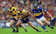 11 June 2000; Alan Markham of Clare in action against John Leahy of Tipperary during the Guinness Munster Senior Hurling Championship Semi-Final match between Tipperary and Clare at Páirc Ui Chaoimh in Cork. Photo by Ray McManus/Sportsfile