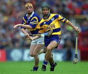 11 June 2000; Eamonn Corcoran of Tipperary in action against David Forde of Clare during the Guinness Munster Senior Hurling Championship Semi-Final match between Tipperary and Clare at Páirc Ui Chaoimh in Cork. Photo by Ray McManus/Sportsfile