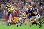 11 June 2000; Jamesie O'Connor of Clare in action against Eamonn Corcoran of Tipperary during the Guinness Munster Senior Hurling Championship Semi-Final match between Tipperary and Clare at Páirc Ui Chaoimh in Cork. Photo by Ray McManus/Sportsfile