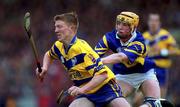11 June 2000; Niall Gilligan of Clare in action against Michael Ryan of Tipperary during the Guinness Munster Senior Hurling Championship Semi-Final match between Tipperary and Clare at Páirc Ui Chaoimh in Cork. Photo by Ray McManus/Sportsfile