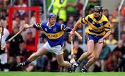 11 June 2000; Sean McMahon of Clare in action against Eugene O'Neill of Tipperary during the Guinness Munster Senior Hurling Championship Semi-Final match between Tipperary and Clare at Páirc Ui Chaoimh in Cork. Photo by Ray McManus/Sportsfile