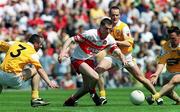 25 June 2000; Enda Muldoon of Derry in action against, Martin Mulholland, left and Aidan Morris of Antrim during the Bank of Ireland Ulster Senior Football Championship Semi-Final match between Antrim and Derry at Casement Park in Belfast, Antrim. Photo by David Maher/Sportsfile