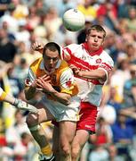 25 June 2000; Niall McCusker of Derry in action against John Kelly of Antrim during the Bank of Ireland Ulster Senior Football Championship Semi-Final match between Antrim and Derry at Casement Park in Belfast, Antrim. Photo by David Maher/Sportsfile