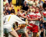 25 June 2000; Niall McCusker of Derry in action against Sean McGreevy of Antrim during the Bank of Ireland Ulster Senior Football Championship Semi-Final match between Antrim and Derry at Casement Park in Belfast, Antrim. Photo by David Maher/Sportsfile
