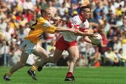 25 June 2000; Patrick Bradley of Derry in action against Enda McLernon of Antrim during the Bank of Ireland Ulster Senior Football Championship Semi-Final match between Antrim and Derry at Casement Park in Belfast, Antrim. Photo by David Maher/Sportsfile