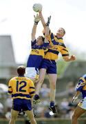 25 June 2000; David Russell of Clare contests a kickout with Liam England of Tipperary during the Bank of Ireland Munster Senior Football Championship Semi-Final match between Clare and Tipperary at the Gaelic Grounds in Limerick. Photo by Brendan Moran/Sportsfile