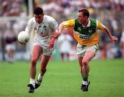 25 June 2000; Dermot Earley of Kildare in action against Barry Mooney of Offaly during the Bank of Ireland Leinster Senior Football Championship Semi-Final match between Kildare and Offaly at Croke Park in Dublin. Photo by Aoife Rice/Sportsfile