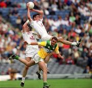 25 June 2000; Dermot Earley of Kildare catches a kickout ahead of team-mate Martin Lynch, left, and James Grennan of Offaly during the Bank of Ireland Leinster Senior Football Championship Semi-Final match between Kildare and Offaly at Croke Park in Dublin. Photo by Ray McManus/Sportsfile