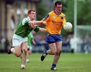 4 June 2000; Donal Cassidy of Roscommon is tackled by Barry McDonagh of London during the Bank of Ireland Connacht Senior Football Championship Quarter-Final match between London and Roscommon at Emerald GAA Grounds in Ruislip, England. Photo by Aoife Rice/Sportsfile