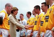 2 July 2000;  President of Ireland Mary McAleese shakes hands with Gearoid Adams of Antrim, in the company of Antrim captain Anto Finnegan, prior to the Bank of Ireland Ulster Senior Football Championship Semi-Final Replay between Antrim and Derry at Casement Park in Belfast, Antrim. Photo by Aoife Rice/Sportsfile