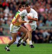 25 June 2000; Glenn Ryan of Kildare in action against Mel Keenaghan of Offaly during the Bank of Ireland Leinster Senior Football Championship Semi-Final match between Kildare and Offaly at Croke Park in Dublin. Photo by Ray McManus/Sportsfile