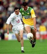 25 June 2000; James Grennan of Offaly in action against John Doyle of Kildare during the Bank of Ireland Leinster Senior Football Championship Semi-Final match between Kildare and Offaly at Croke Park in Dublin. Photo by Ray McManus/Sportsfile
