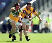 18 June 2000; Jason Lawlor of Wexford in action against Johnny Pilkington of Offaly during the Guinness Leinster Senior Hurling Championship Semi-Final match between Offaly and Wexford at Croke Park in Dublin. Photo by Ray McManus/Sportsfile