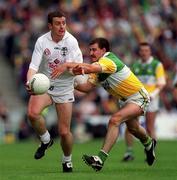 25 June 2000; Brian Murphy of Kildare in action against Mel Keenaghan of Offaly during the Bank of Ireland Leinster Senior Football Championship Semi-Final match between Kildare and Offaly at Croke Park in Dublin. Photo by Ray McManus/Sportsfile