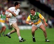 25 June 2000; Ken Doyle of Kildare in action against Mel Keenaghan of Offaly during the Bank of Ireland Leinster Senior Football Championship Semi-Final match between Kildare and Offaly at Croke Park in Dublin. Photo by Ray McManus/Sportsfile