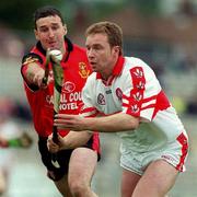 11 June 2000; Kieran McKeever of Derry in action against Donal Byers of Down during the Guinness Ulster Senior Hurling Championship Semi-Final between Derry and Down at Casement Park in Belfast, Antrim. Photo by Aoife Rice/Sportsfile
