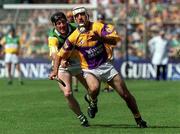 18 June 2000; Martin Storey of Wexford in action against Brian Whelahan of Offaly during the Guinness Leinster Senior Hurling Championship Semi-Final match between Offaly and Wexford at Croke Park in Dublin. Photo by Aoife Rice/Sportsfile