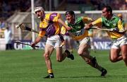 18 June 2000; Martin Storey of Wexford in action against Brian Whelahan and Johnny Dooley of Offaly during the Guinness Leinster Senior Hurling Championship Semi-Final match between Offaly and Wexford at Croke Park in Dublin. Photo by Aoife Rice/Sportsfile