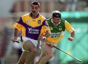 18 June 2000; Martin Storey of Wexford in action against Brian Whelahan of Offaly during the Guinness Leinster Senior Hurling Championship Semi-Final match between Offaly and Wexford at Croke Park in Dublin. Photo by Ray McManus/Sportsfile