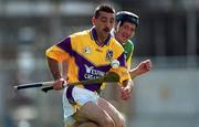 18 June 2000; Martin Storey of Wexford in action against Brian Whelahan of Offaly during the Guinness Leinster Senior Hurling Championship Semi-Final match between Offaly and Wexford at Croke Park in Dublin. Photo by Ray McManus/Sportsfile