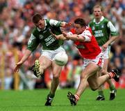 25 June 2000; Paul Brewster of Fermanagh in action against Paul McGrane of Armagh during the Bank of Ireland Ulster Senior Football Championship Semi-Final match between Armagh and Fermanagh at St Tiernach's Park in Clones, Monaghan. Photo by Damien Eagers/Sportsfile