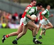 25 June 2000; Raymond Johnson of Fermanagh in action against Andrew McMann of Armagh during the Bank of Ireland Ulster Senior Football Championship Semi-Final match between Armagh and Fermanagh at St Tiernach's Park in Clones, Monaghan. Photo by David Maher/Sportsfile