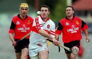 11 June 2000; Ronan McCloskey of Derry in action against John Caughey, left, and Donal Byers of Down during the Guinness Ulster Senior Hurling Championship Semi-Final between Derry and Down at Casement Park in Belfast, Antrim. Photo by Aoife Rice/Sportsfile