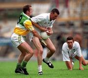 25 June 2000; Bernard O'Brien of Offaly is tackled by Ronan Sweeney of Kildare during the Bank of Ireland Leinster Senior Football Championship Semi-Final match between Kildare and Offaly at Croke Park in Dublin. Photo by Ray McManus/Sportsfile