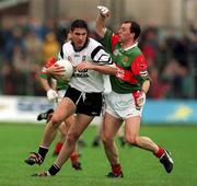 11 June 2000; Sean Davey of Sligo is tackled by Kenneth Mortimer of Mayo during the Bank of Ireland Connacht Senior Football Championship Quarter-Final match between Sligo and Mayo at Markievicz Park in Sligo. Photo by Damien Eagers/Sportsfile
