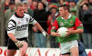11 June 2000; Trevor Mortimer of Mayo in action against Mark Cosgrove of Sligo during the Bank of Ireland Connacht Senior Football Championship Quarter-Final match between Sligo and Mayo at Markievicz Park in Sligo. Photo by Damien Eagers/Sportsfile