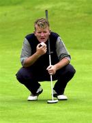 30 June 2000; Paddy Gribben of Ireland watches the lie of the 13th green during the second day of the Murphy's Irish Open Golf Championship at Ballybunion Golf Club in Kerry. Photo by Brendan Moran/Sportsfile